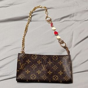 Louis Vuitton Monogram Clutch with Gold and Red Accents